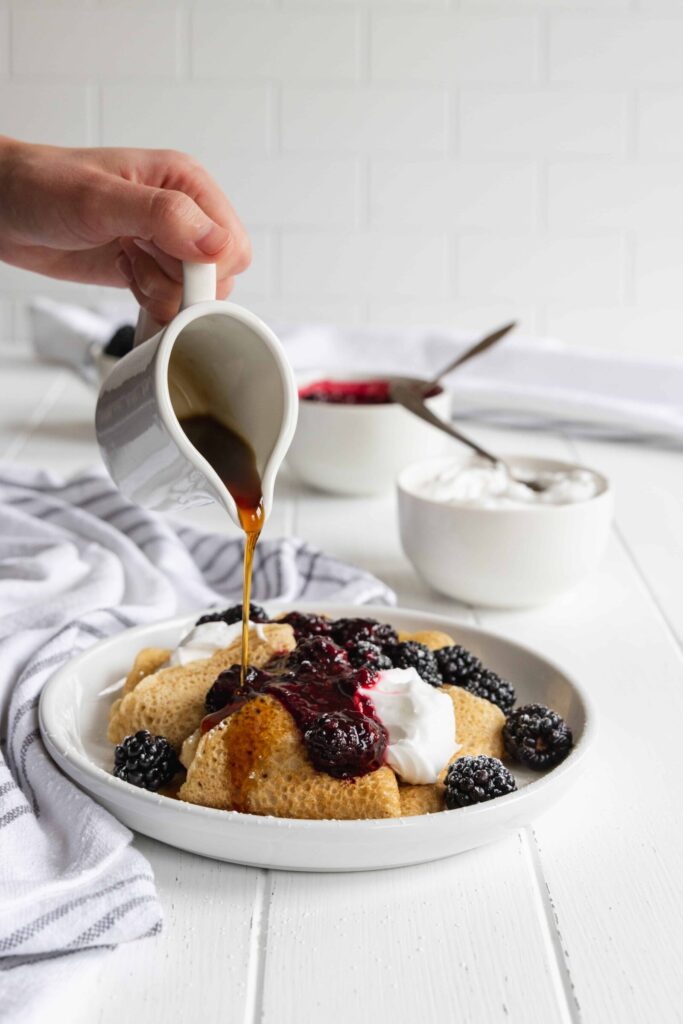 Crepes with Lemon Cream Cheese and Blackberry Filling with a drizzle of maple syrup