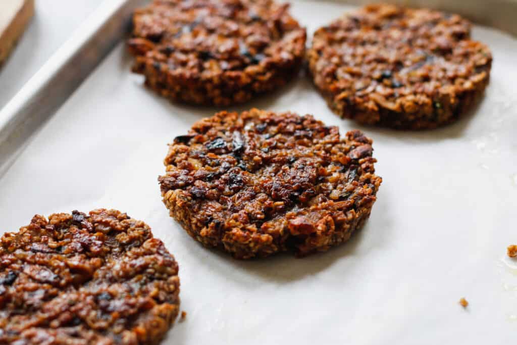 Mushroom Oat Burgers on a baking sheet tray