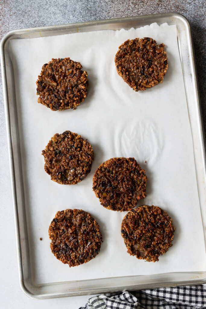 Mushroom Oat Burgers on a baking sheet tray