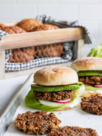Mushroom Oat Burgers served with fresh burger buns and avocado