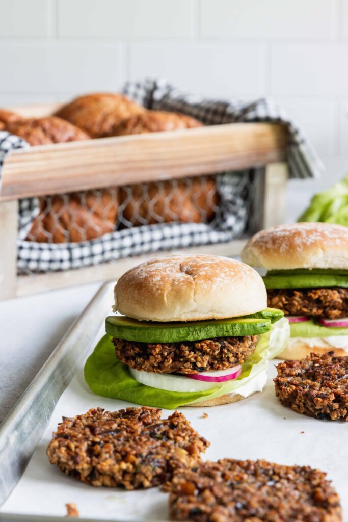 Mushroom Oat Burgers served with fresh burger buns and avocado 