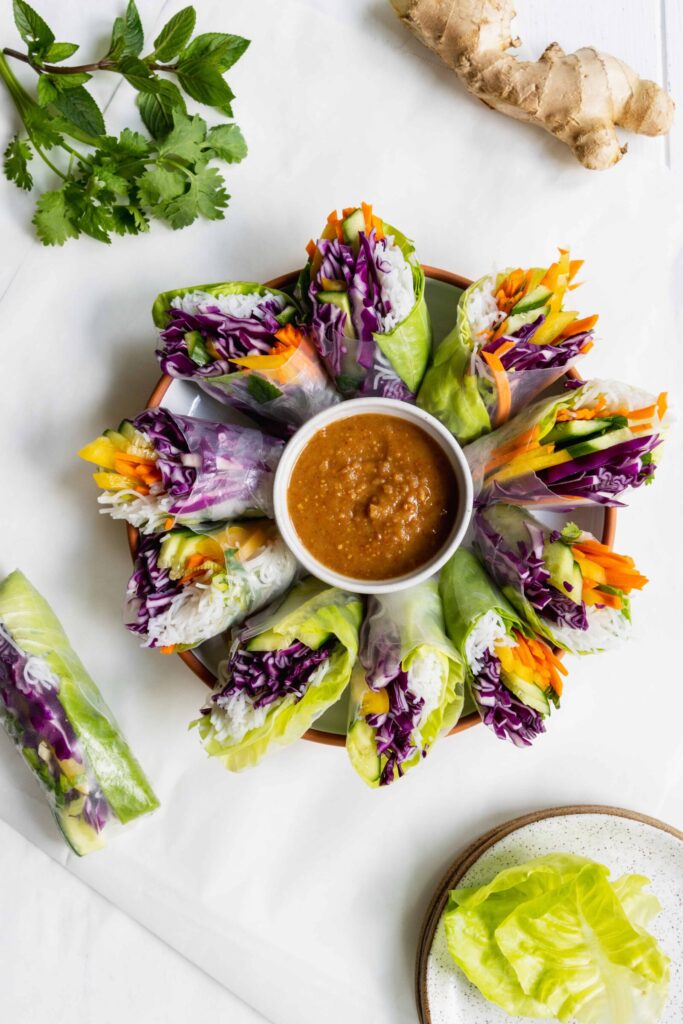 Summer Vegetable Rolls with Peanut Sauce served on a white plate