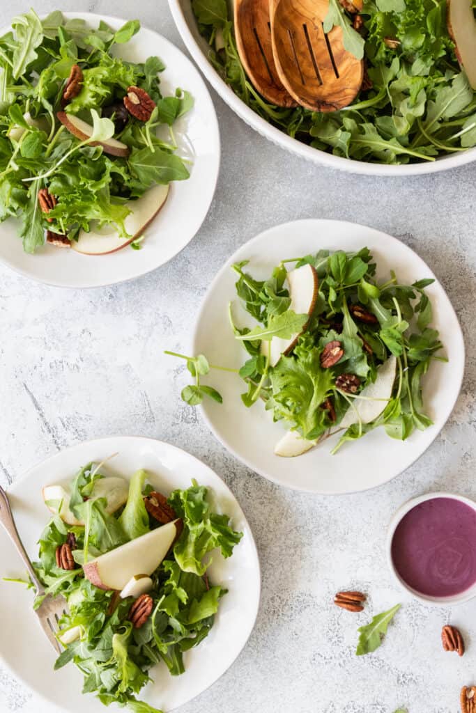 Pear Pecan Green Salad served on three plates