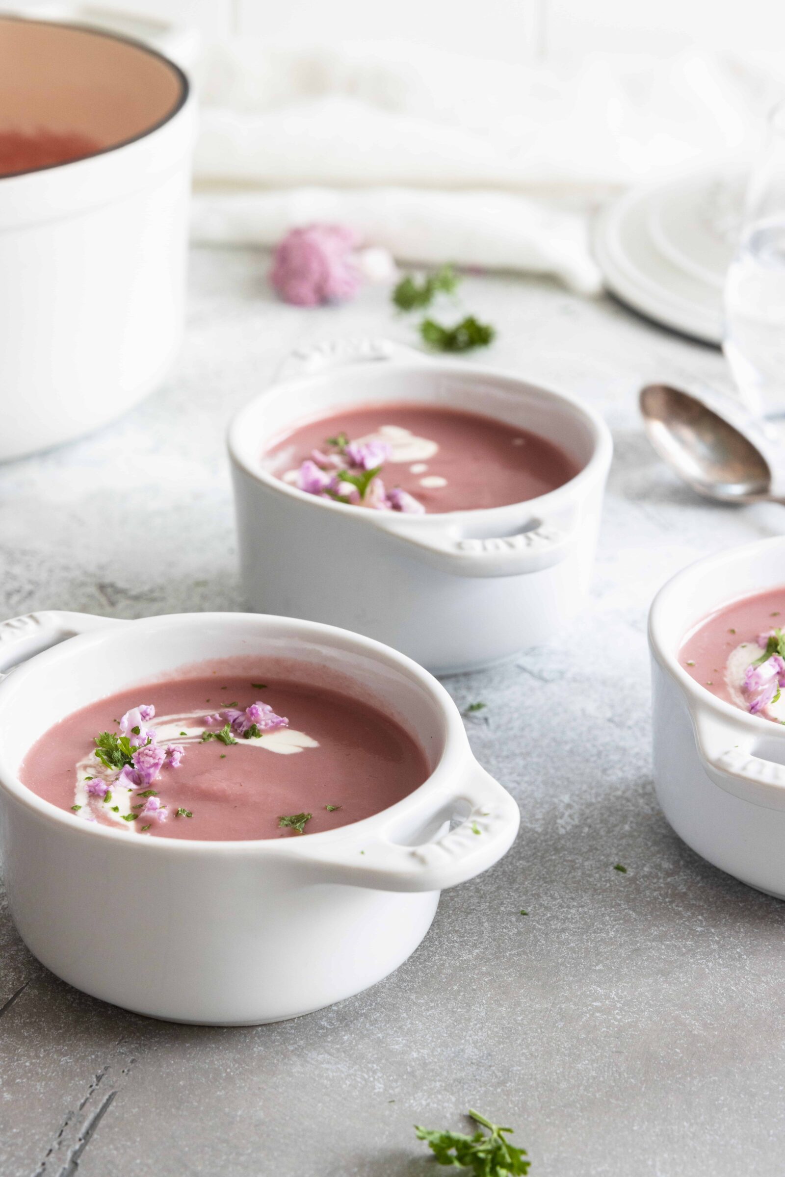 Purple Cauliflower Soup served in three soup dishes