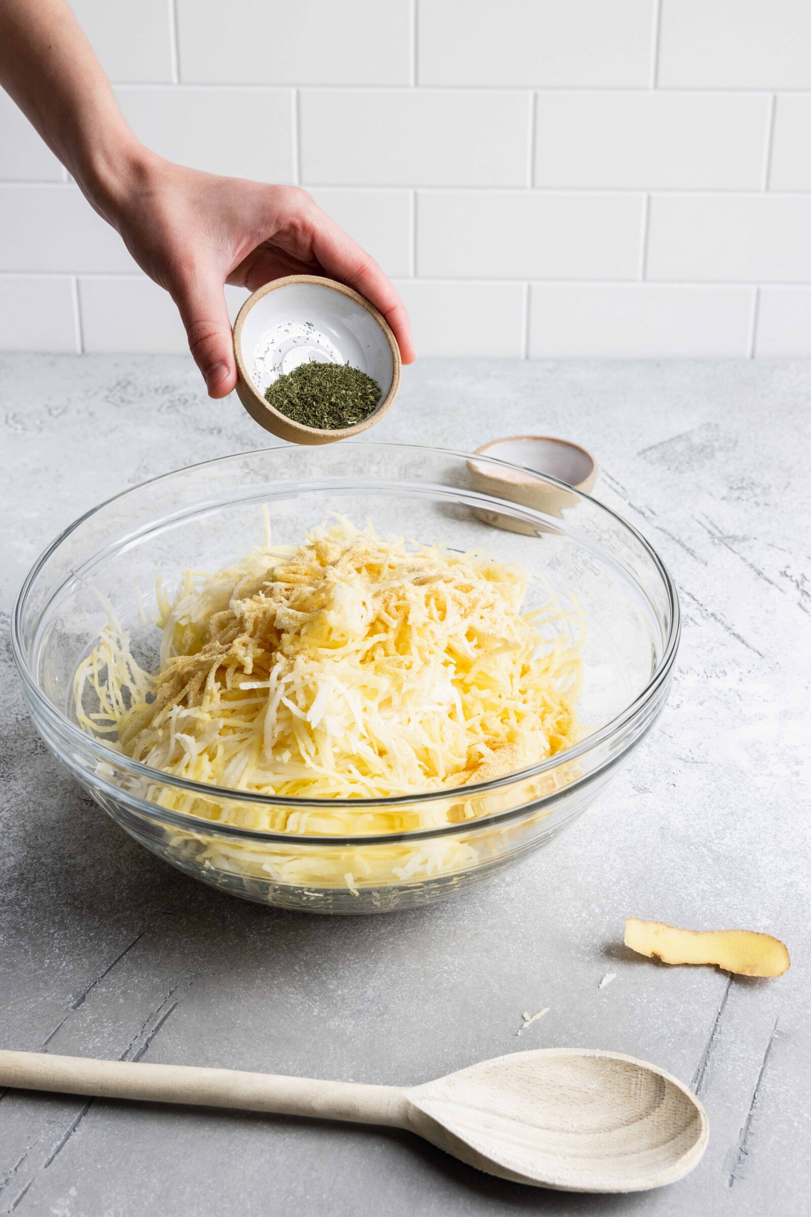 Adding Dried Dill to the potatoes