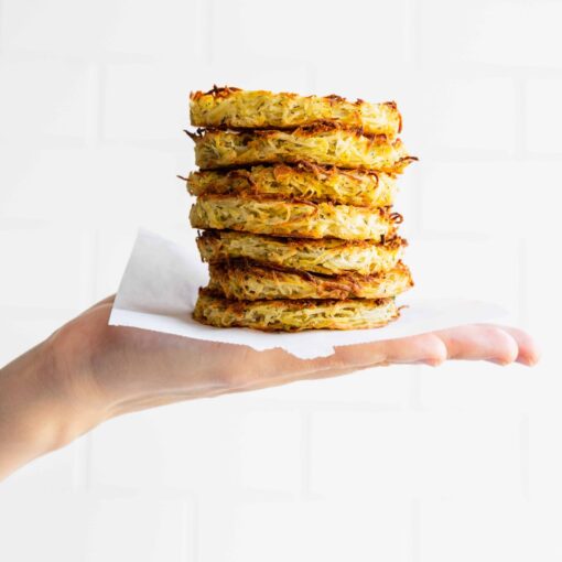 Holding a stack of crispy hash browns