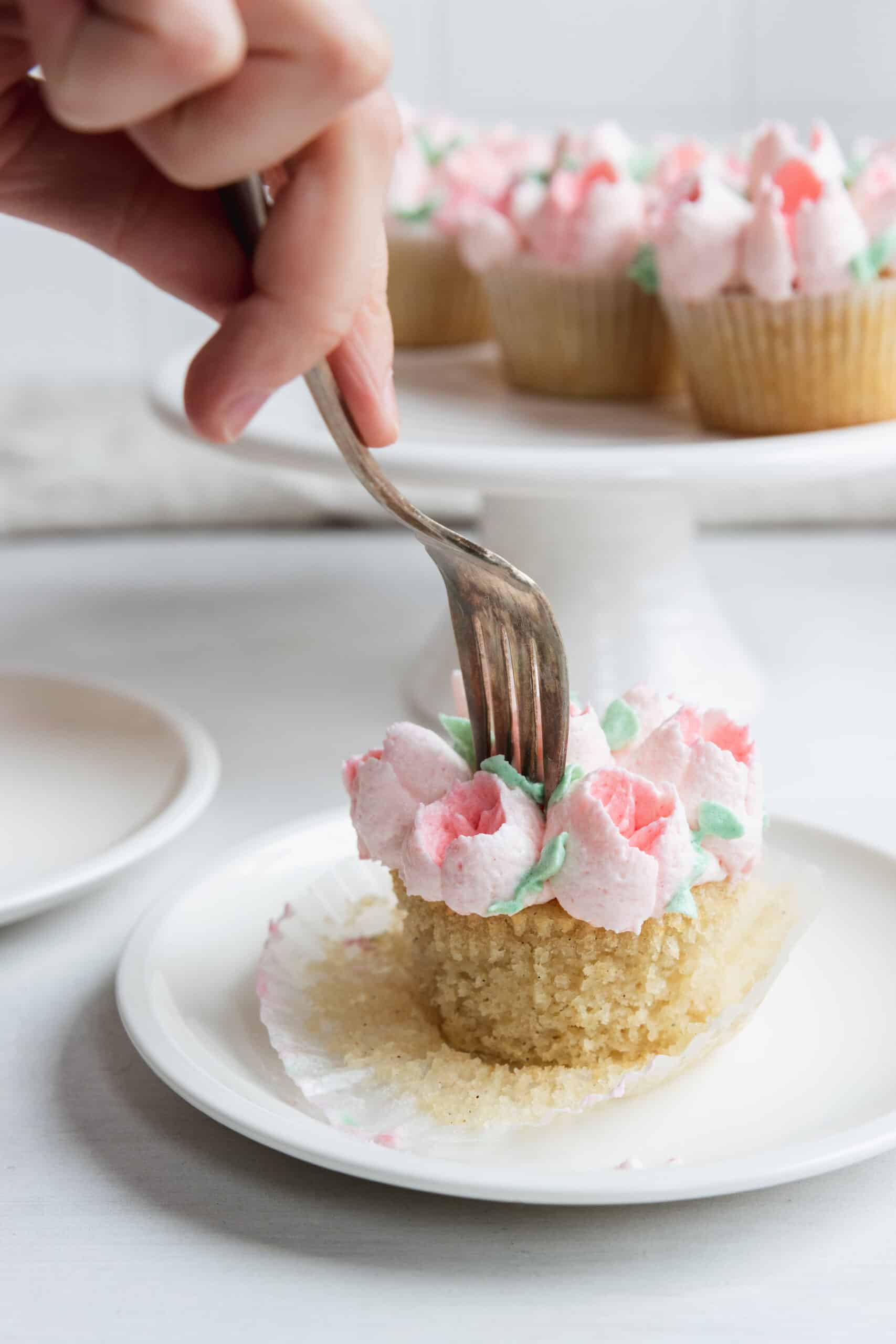 Fork cutting into a cupcake