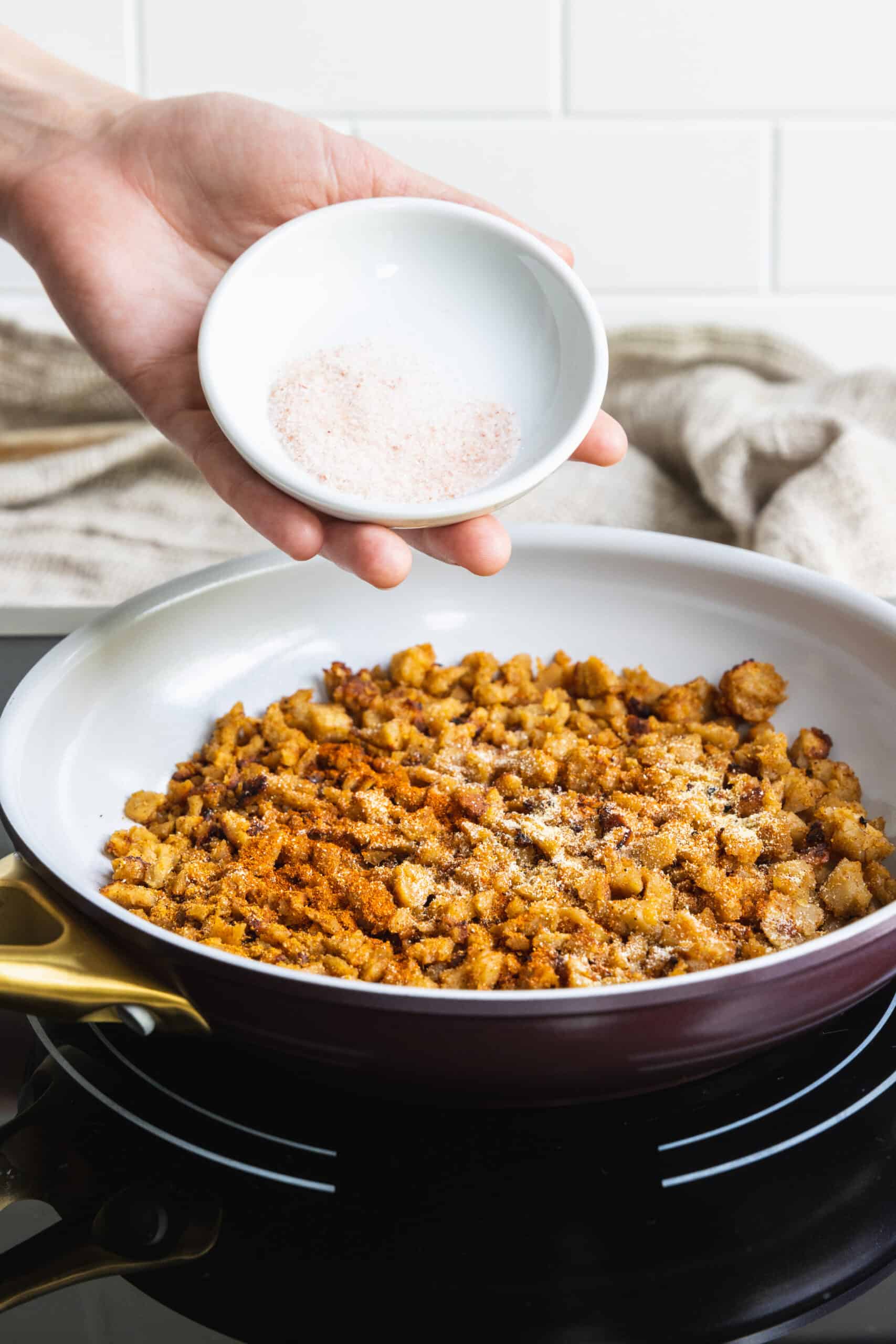 Seasoning the Meatless Crumbles with Salt