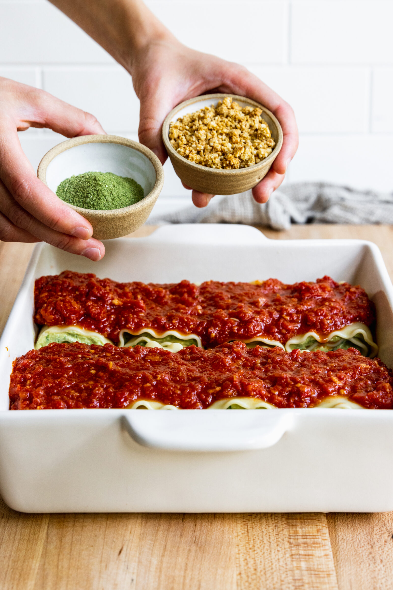 Adding Vegan Parmesan Cheese and dried basil