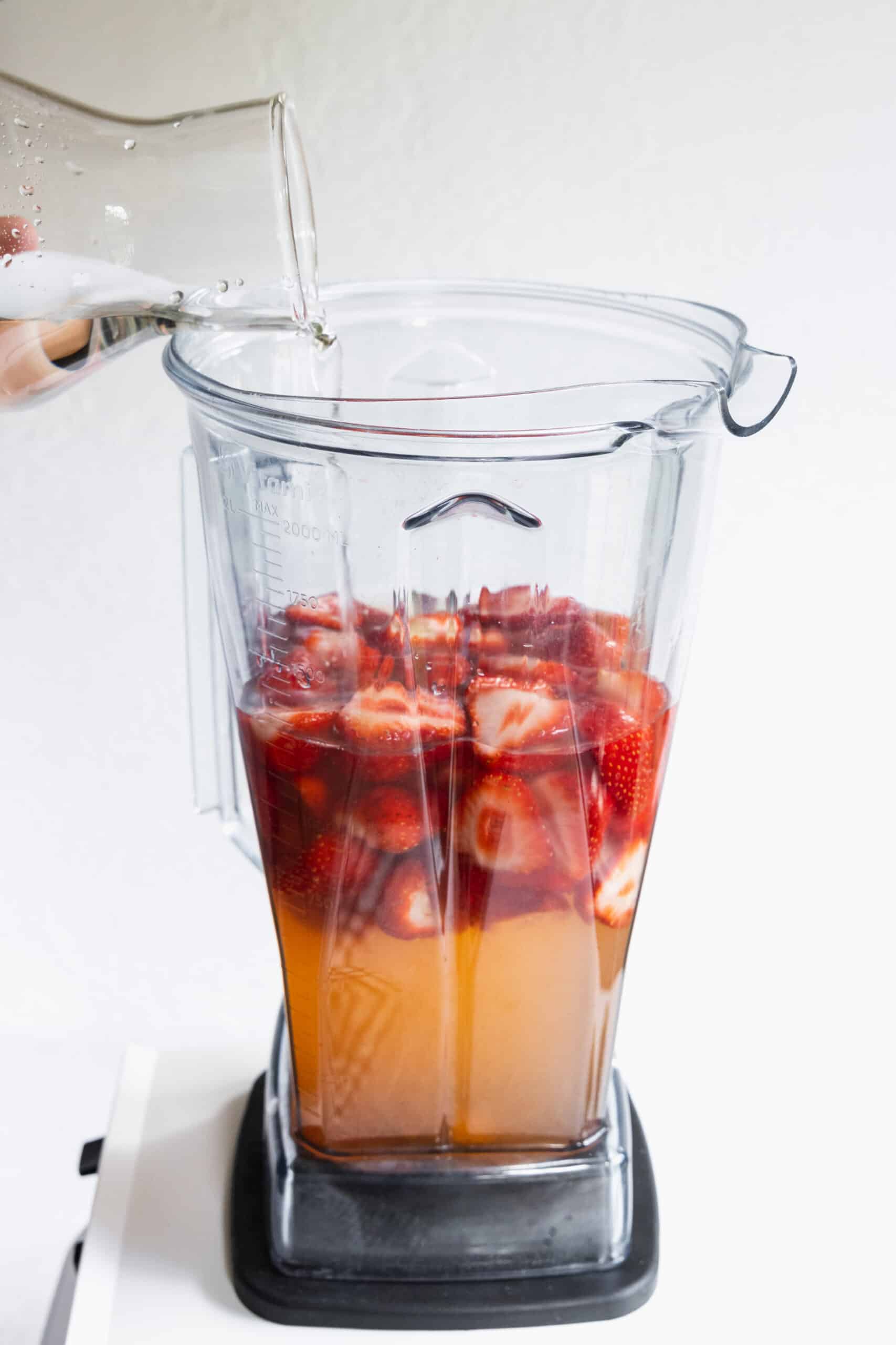 Adding Water to the blender for Strawberry Limeade