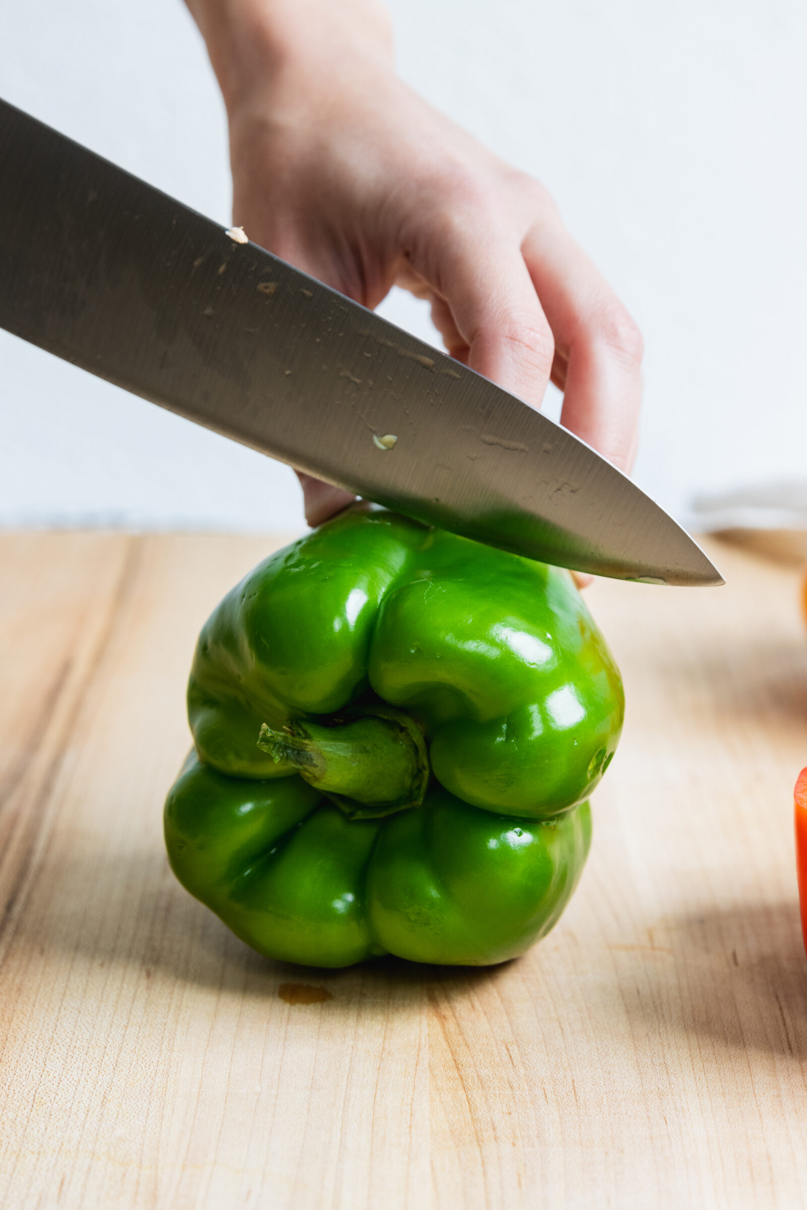 Cutting a Green Pepper in half