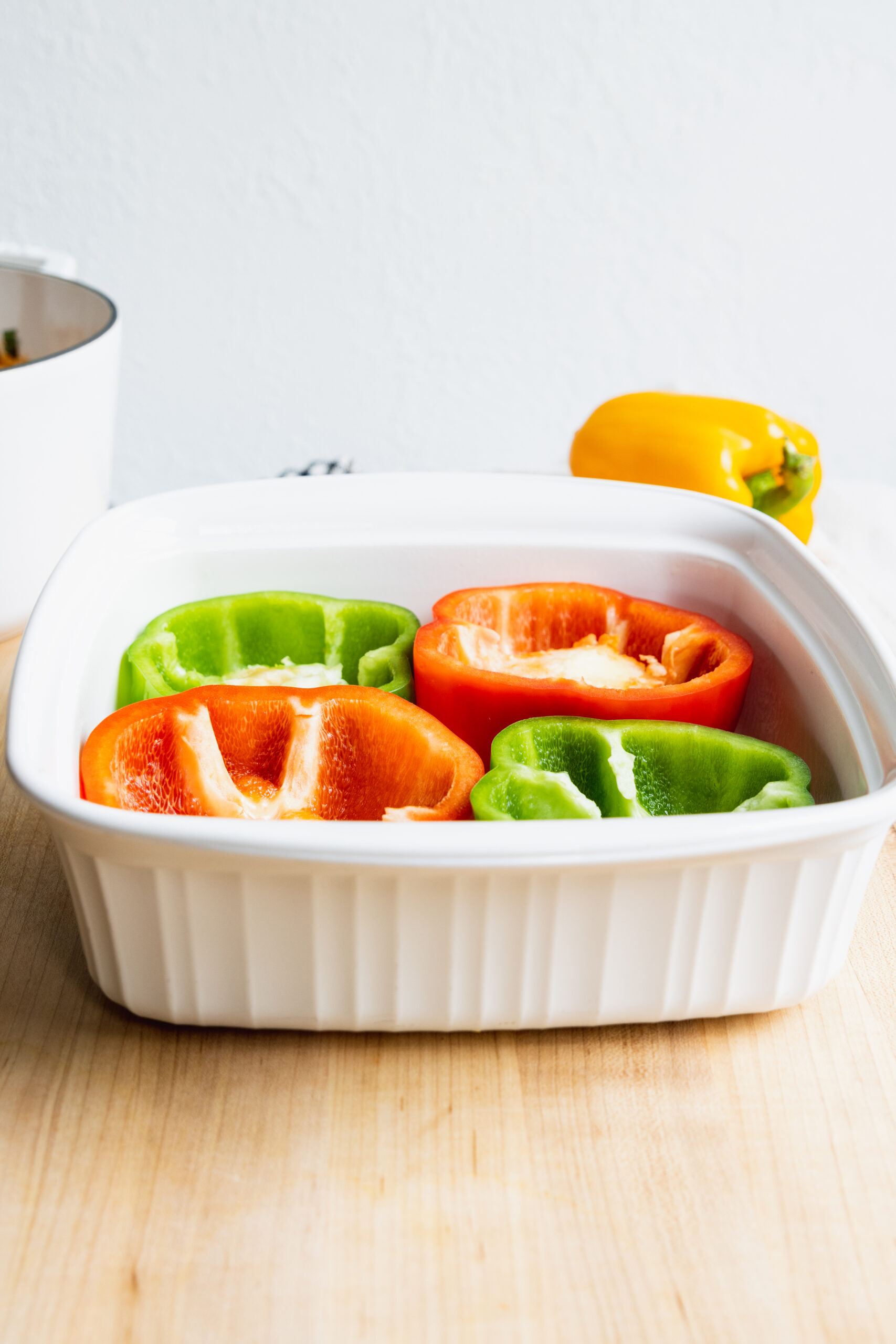 Arranging the peppers in a baking pan