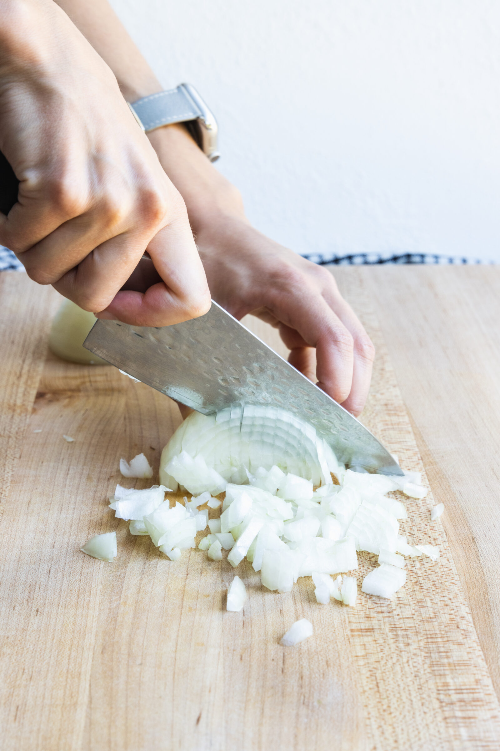 Chopping onion for plant-based chili