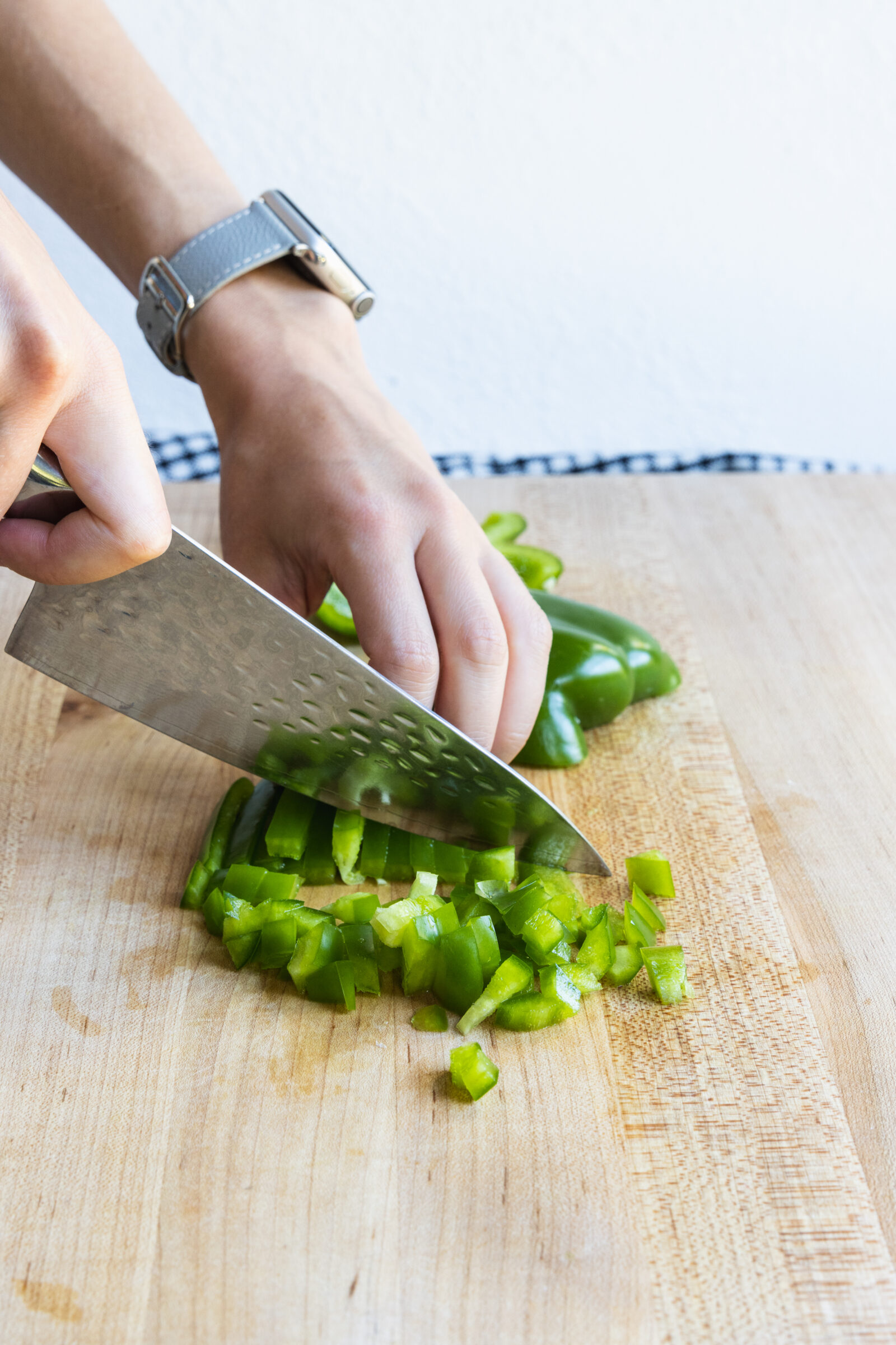 Chopping green pepper for plant based chili