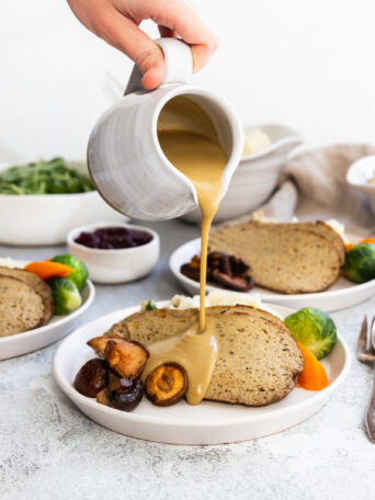 Pouring vegan gravy