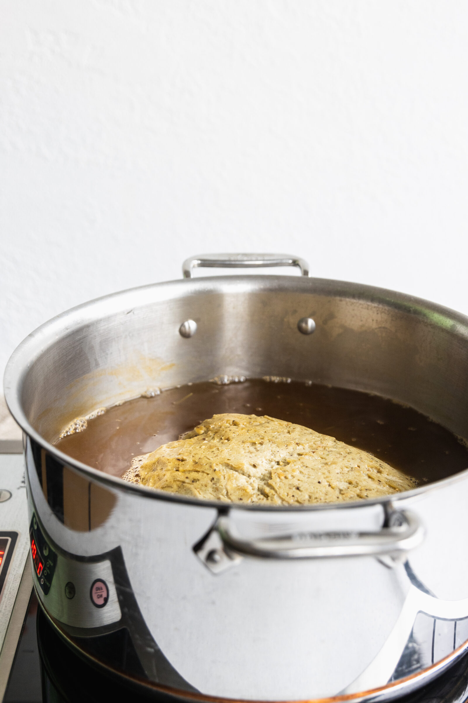 Cooking the vegan turkey roast in the broth