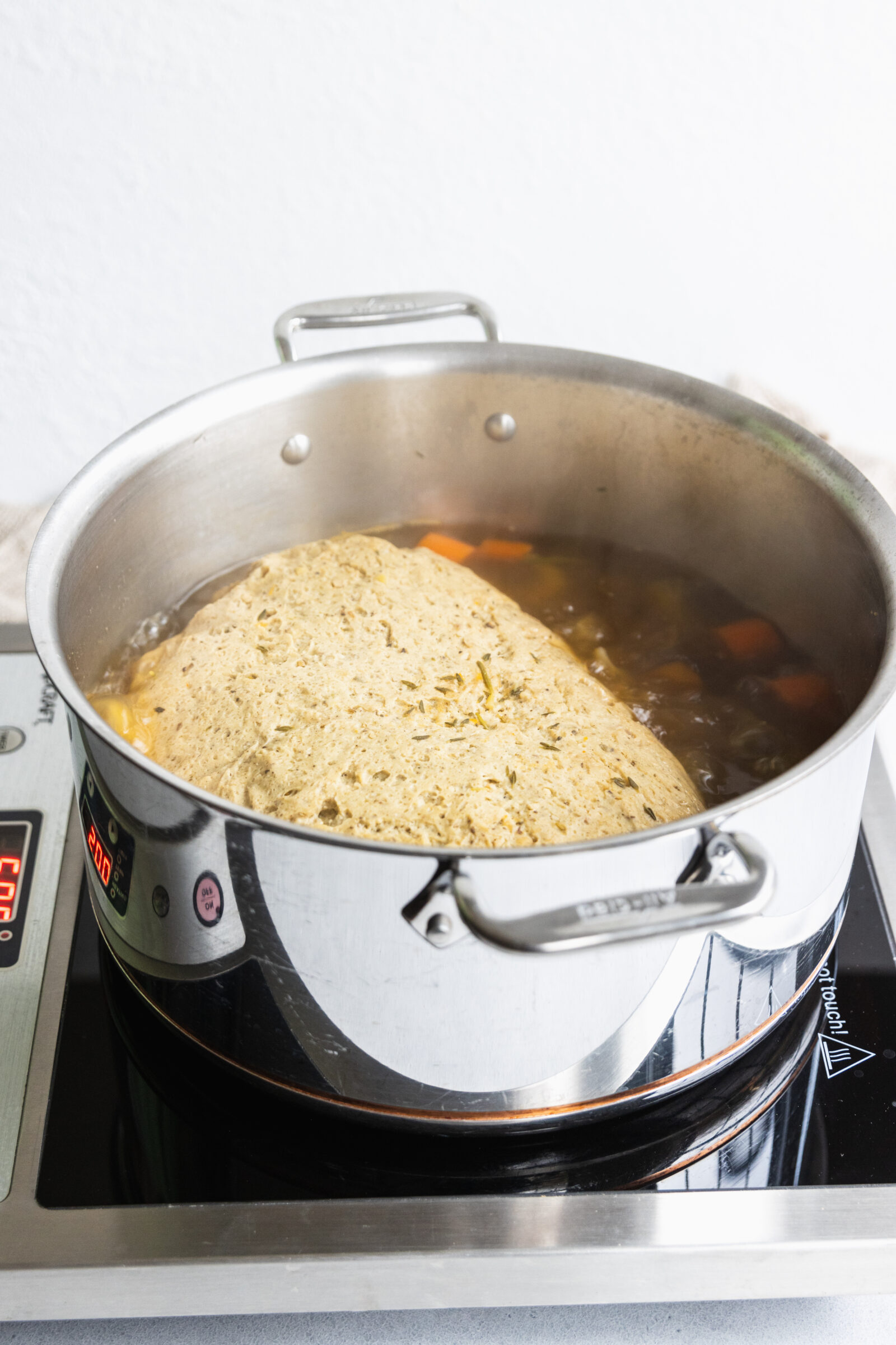 Vegan turkey roast cooking in the broth