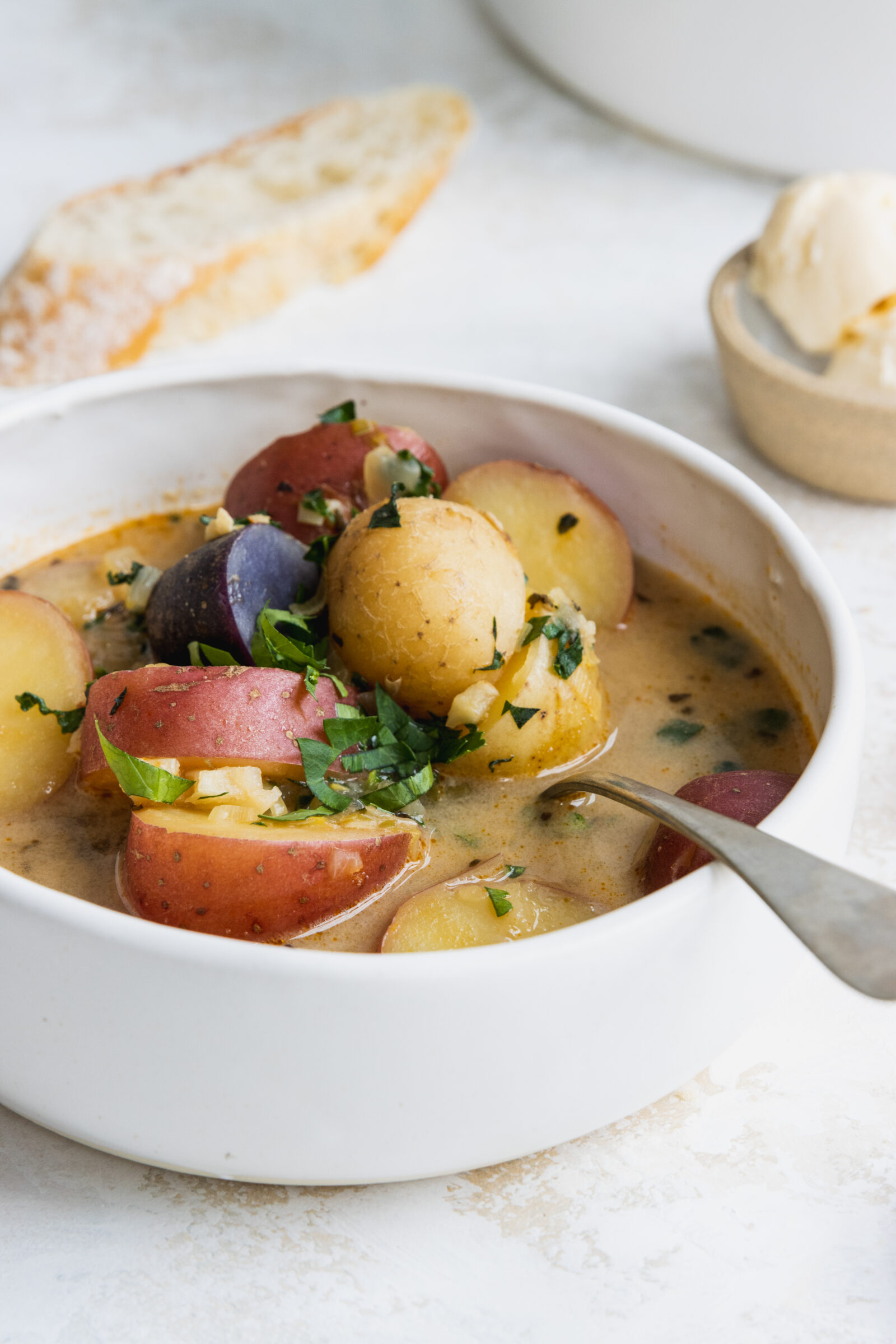 Potato soup served in a white bowl