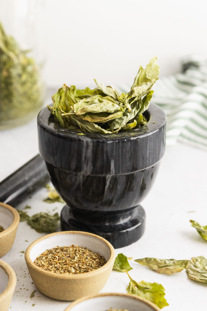 Dried basil in a mortar and pestle