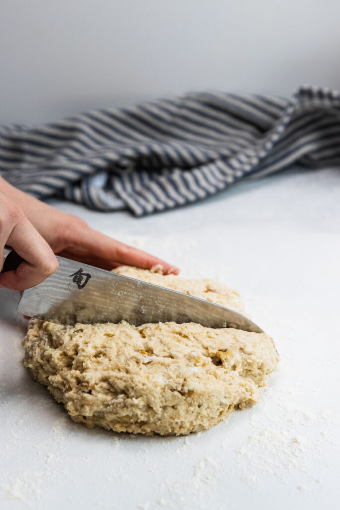 Cutting the walnut scones into 8 scone shapes