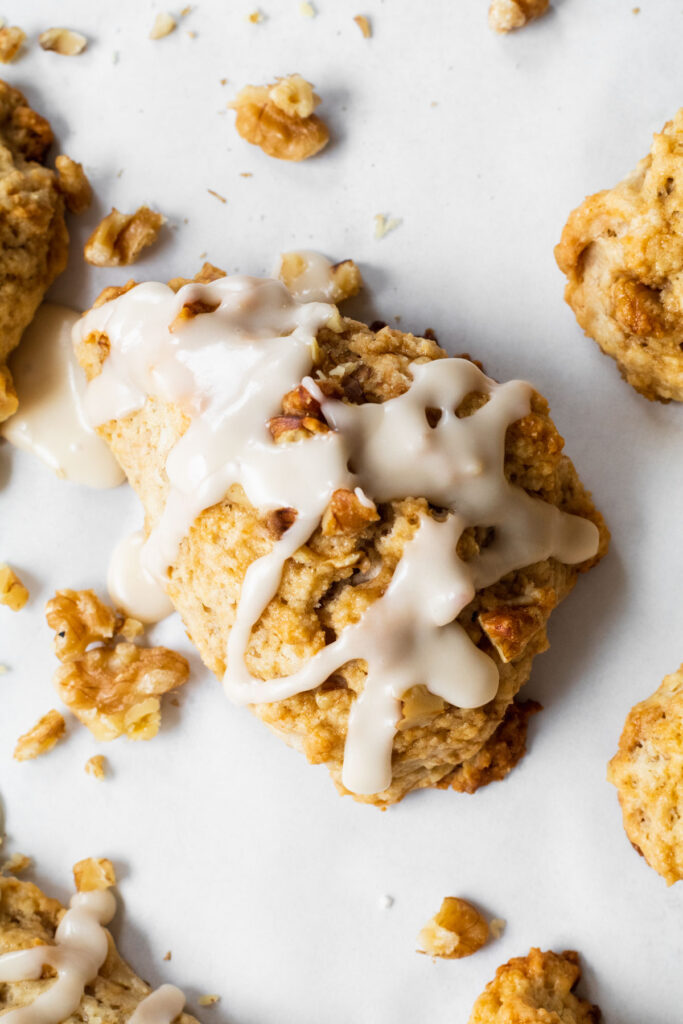 Maple walnut scones served with maple glaze and extra chopped walnuts