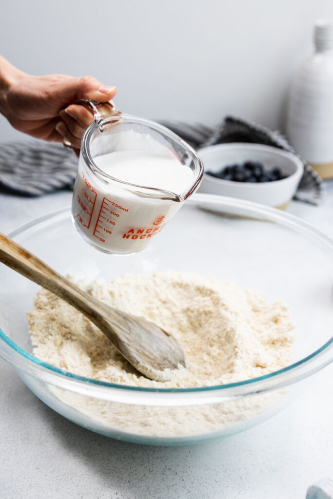 Pouring in the coconut milk