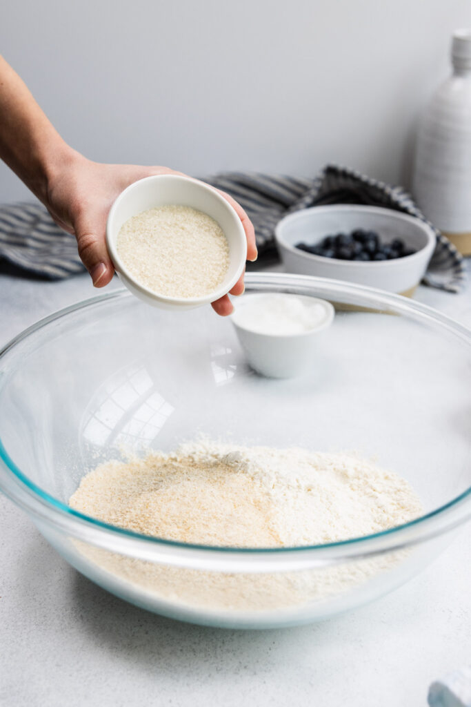 Adding sugar to a bowl