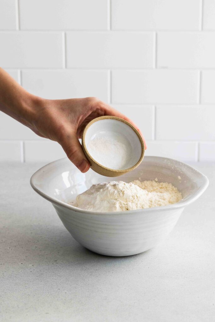 Adding salt to a bowl