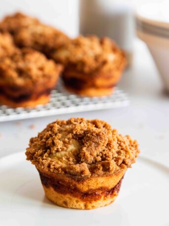 Cinnamon Coffee Cake muffin served on a white plate