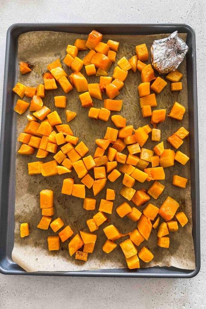 Roasted butternut squash on a baking tray