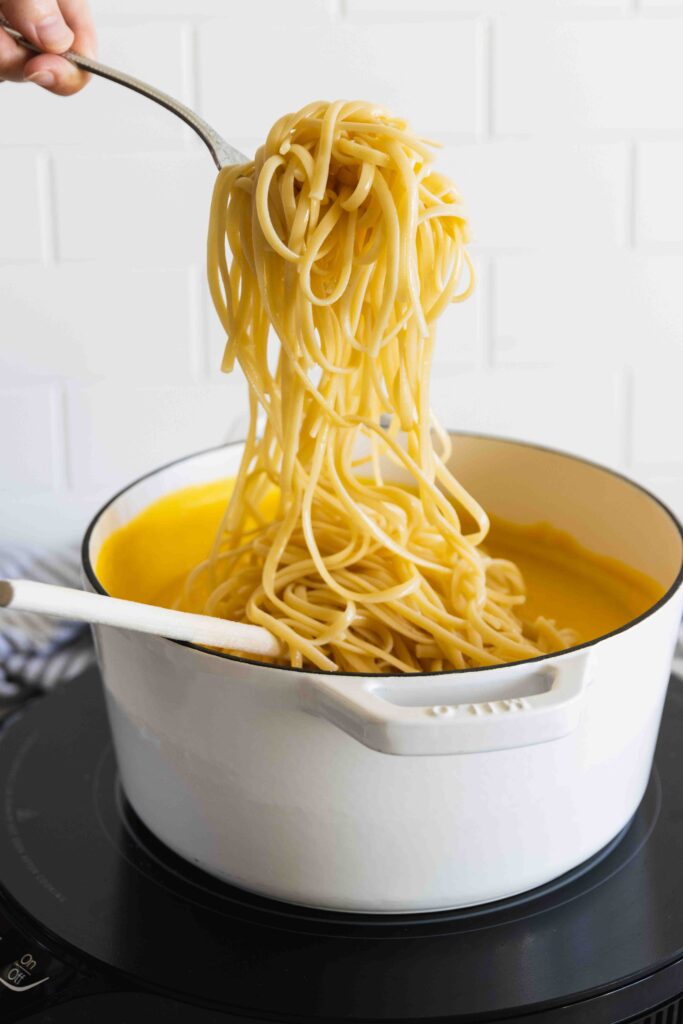 Tossing pasta with the roasted butternut squash sauce
