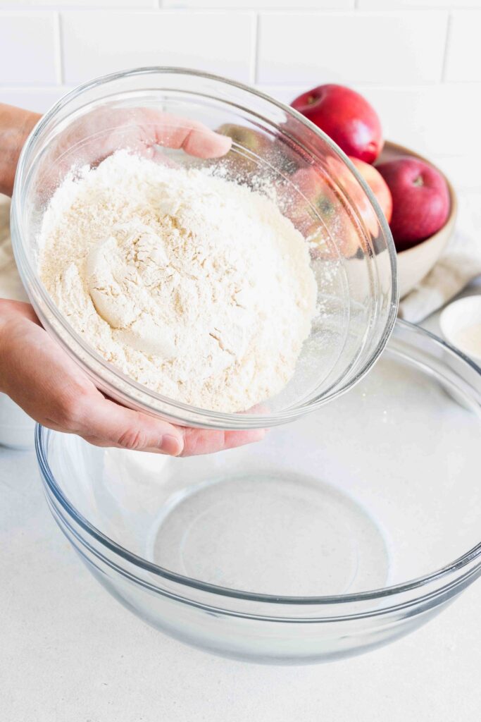 Adding pour to a bowl to make the scone dough