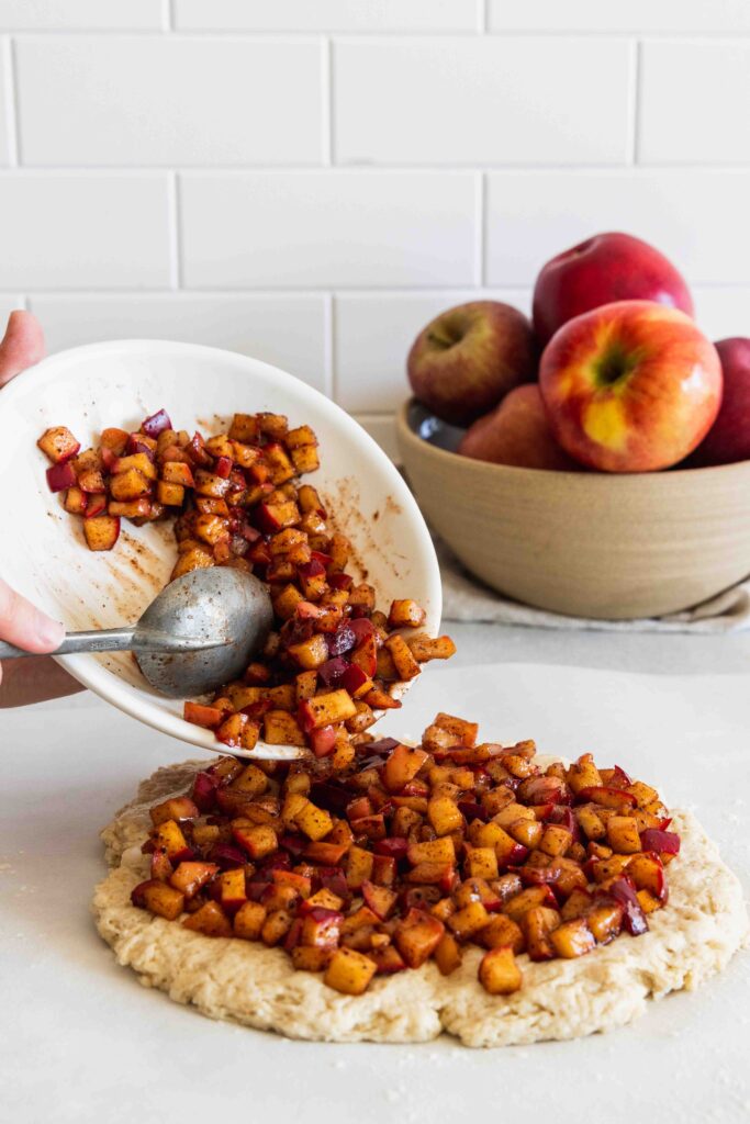 Adding apple filling to the scone dough