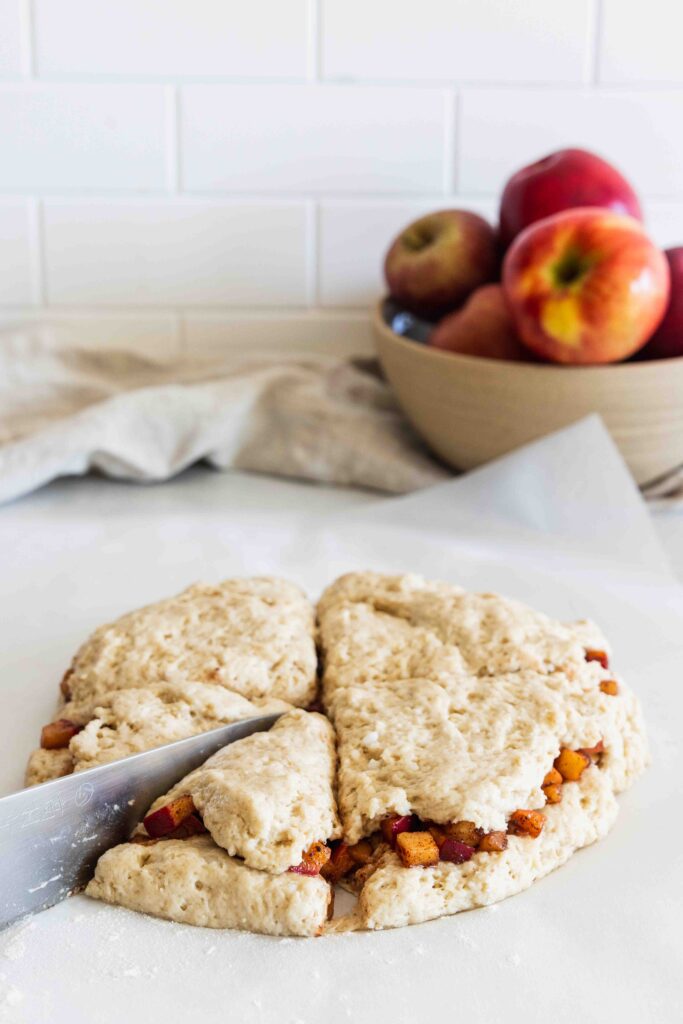 Slicing the apple scones before baking