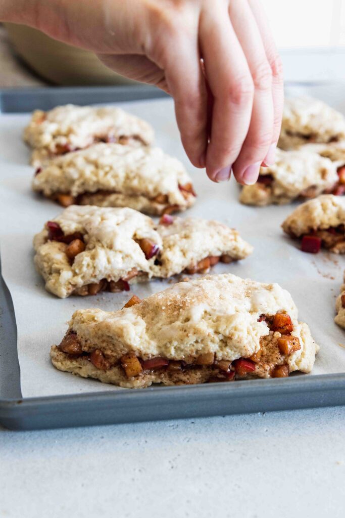 Sprinkling the scones with course sugar