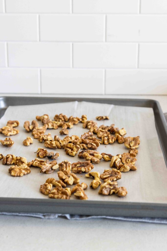 Walnuts on a baking sheet before toasting