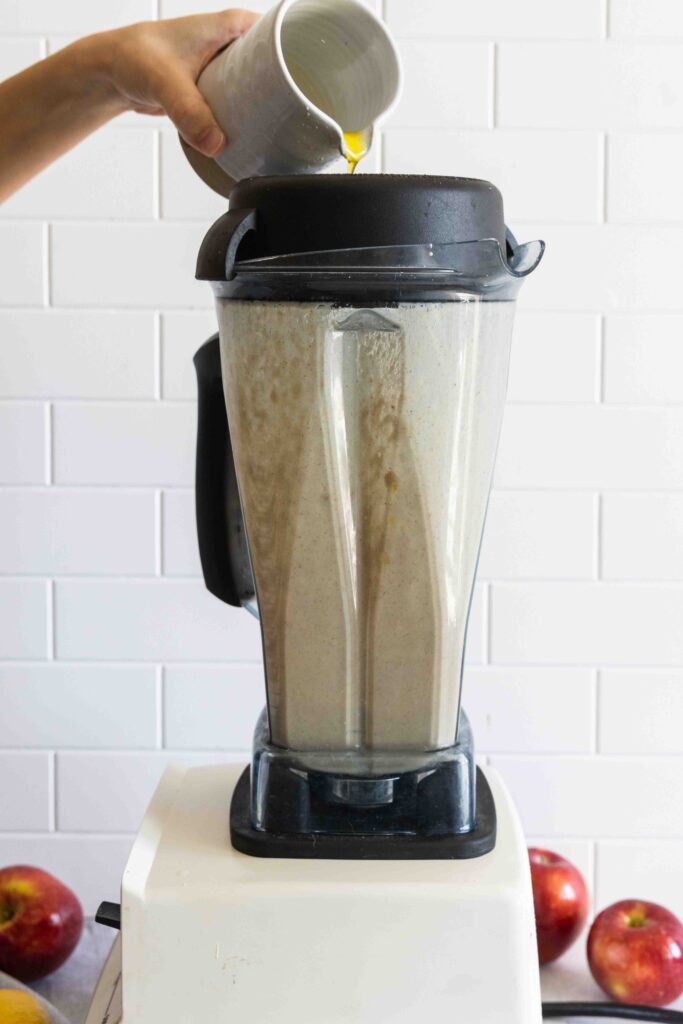 Blending the dressing until smooth in a blender