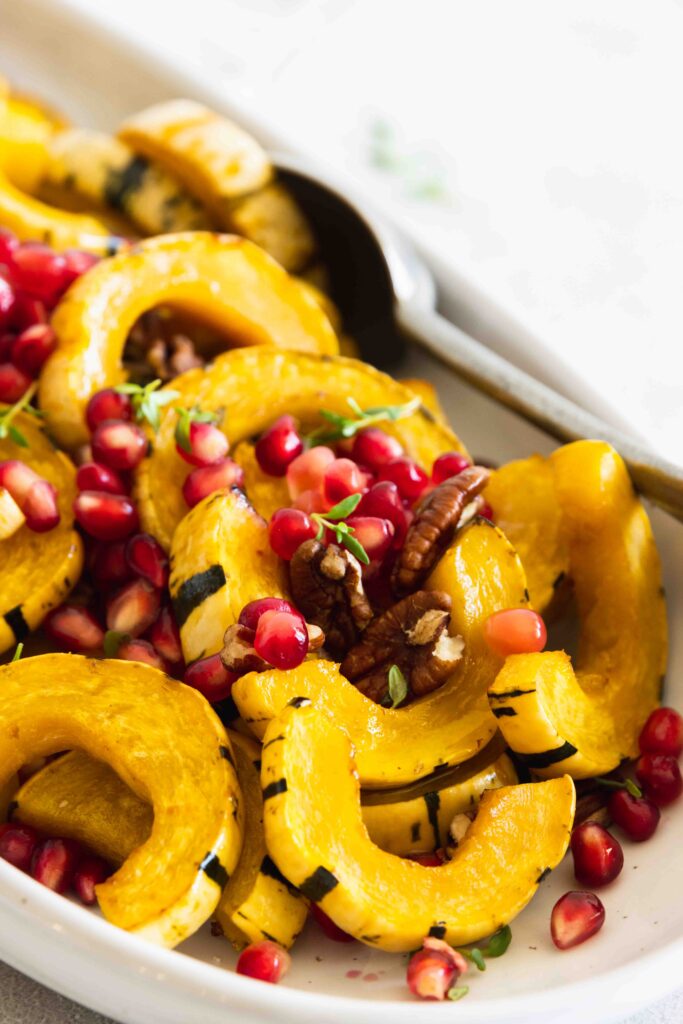 Roasted delicata squash with toasted pecans and fresh pomegranate seeds