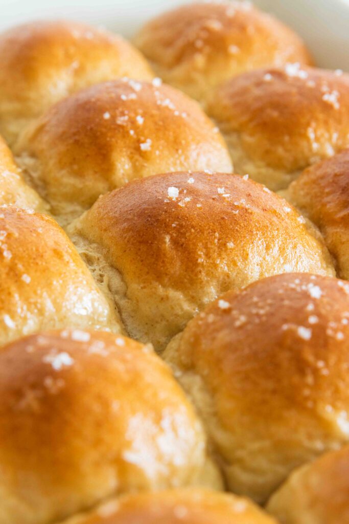 Golden brown vegan dinner rolls fresh from the oven
