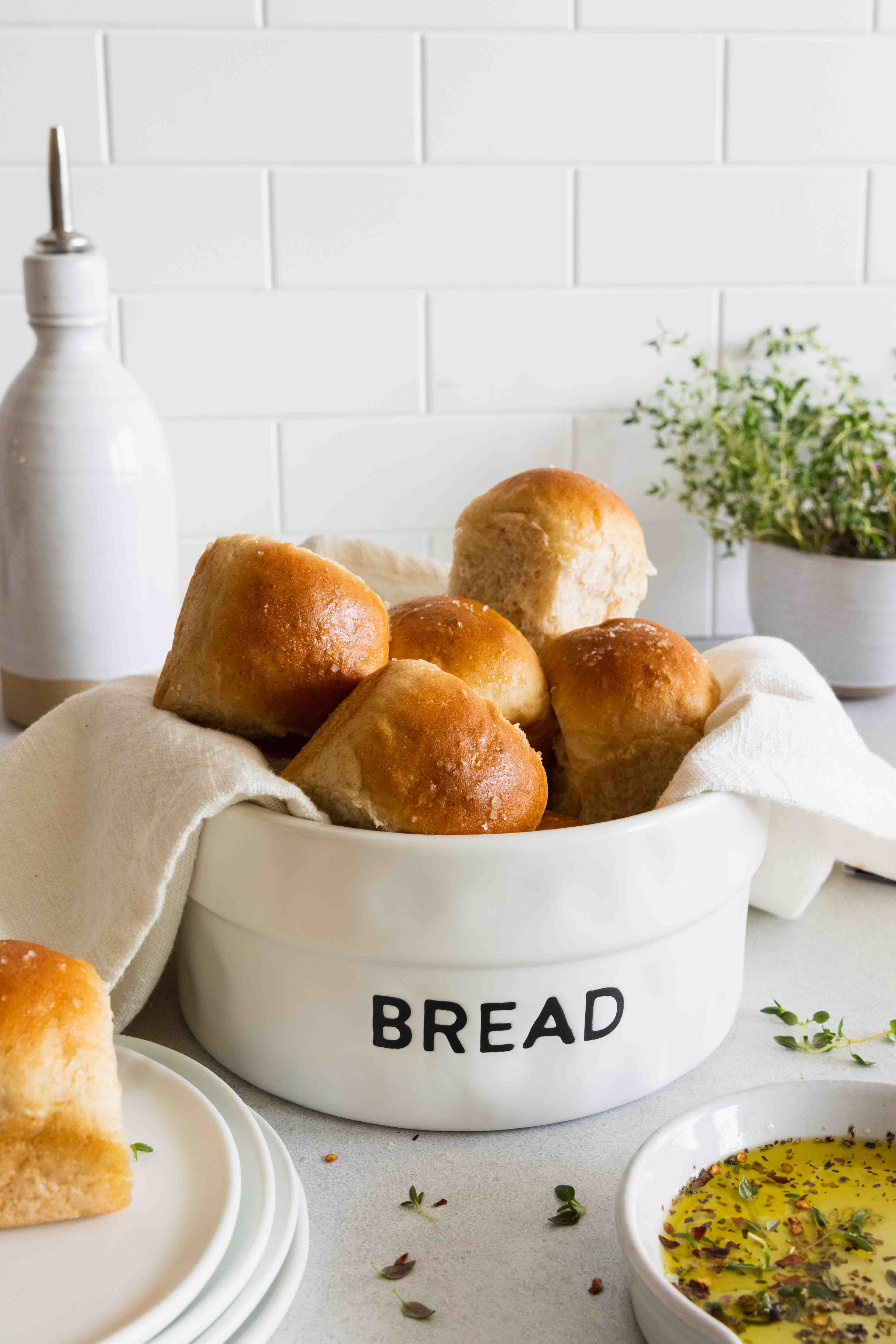 Vegan dinner rolls served in a white bread bowl