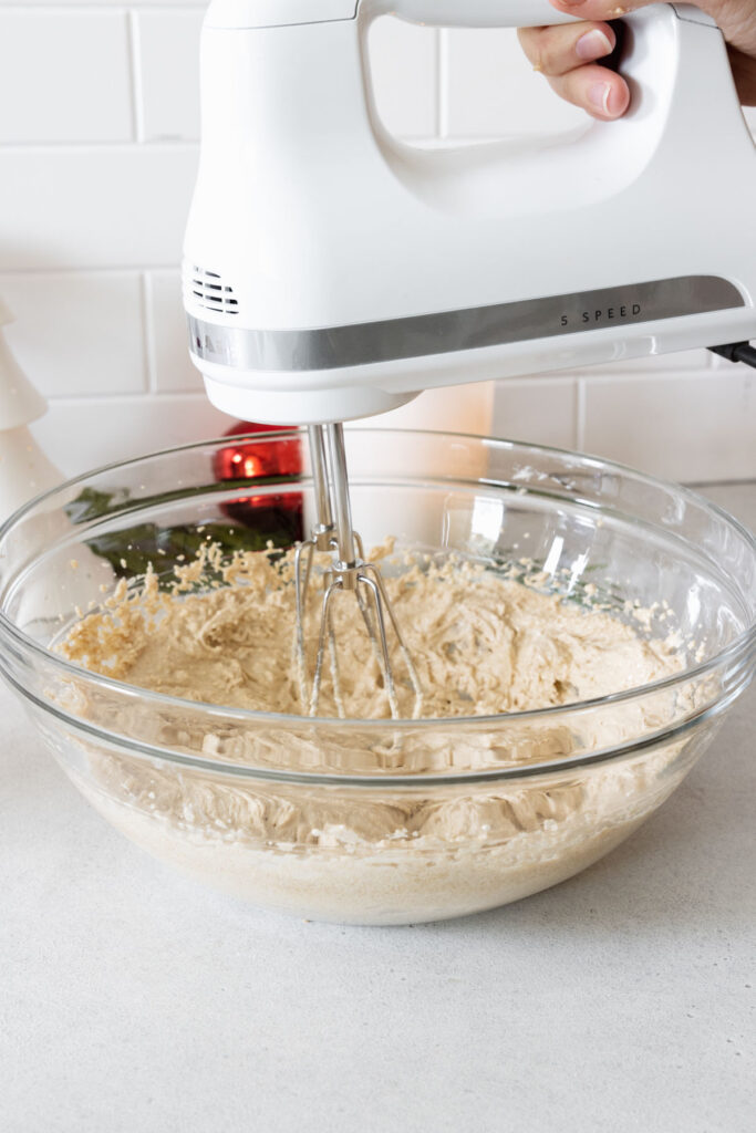 Mixing the sugars and margarine until fluffy