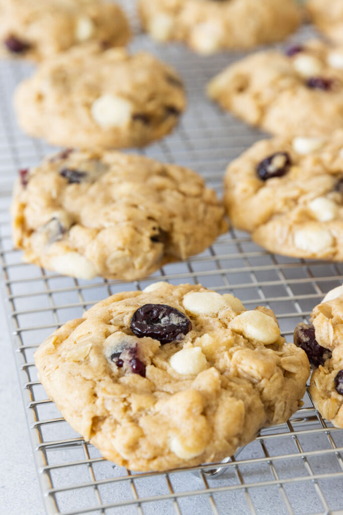 Cranberry white chocolate cookies cooling on a cooling rack