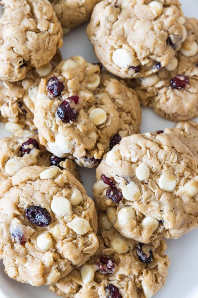Vegan cranberry white chocolate cookies served on a white plate