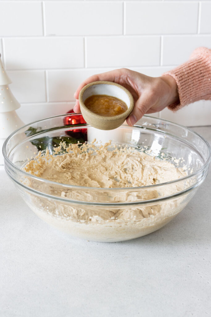 Adding the applesauce to the wet mixture
