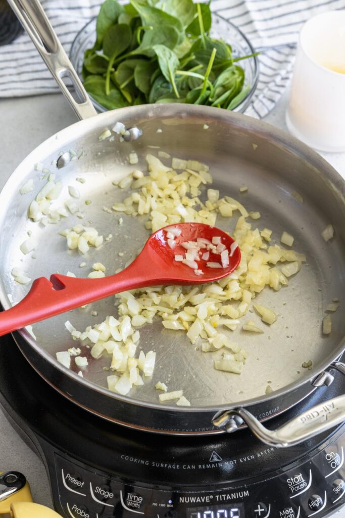 Sautéing onion and garlic before adding the cream