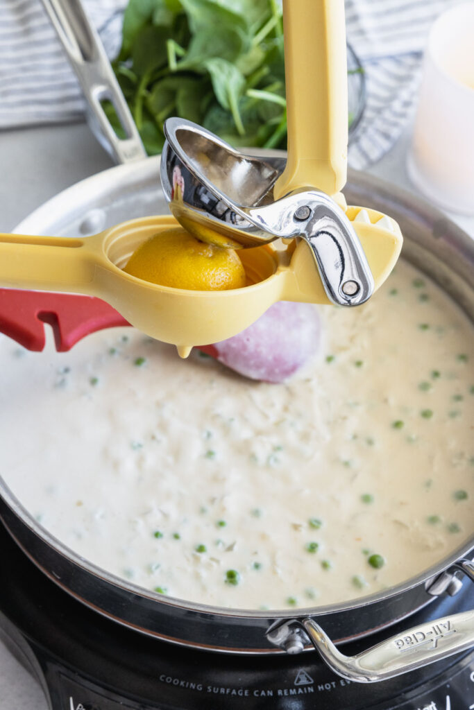 Adding fresh squeezed lemon juice to the sauce