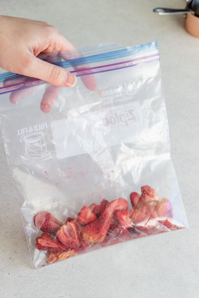 Freeze dried strawberries in a ziplock bag before crushing into powder to add color and flavor to frosting