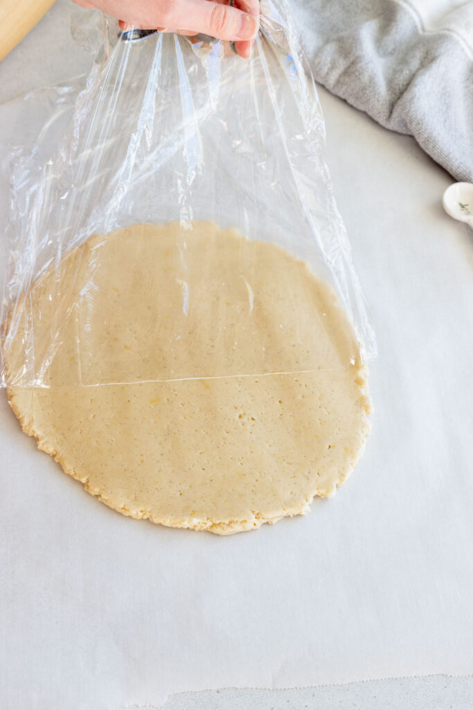 Using a piece of plastic wrap over the cookie dough to prevent sticking
