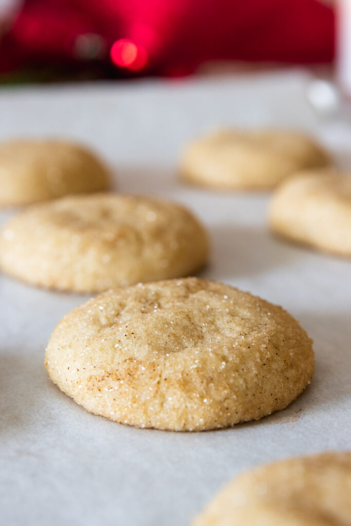 Warm cinnamon sugar cookies cooling on baking sheet