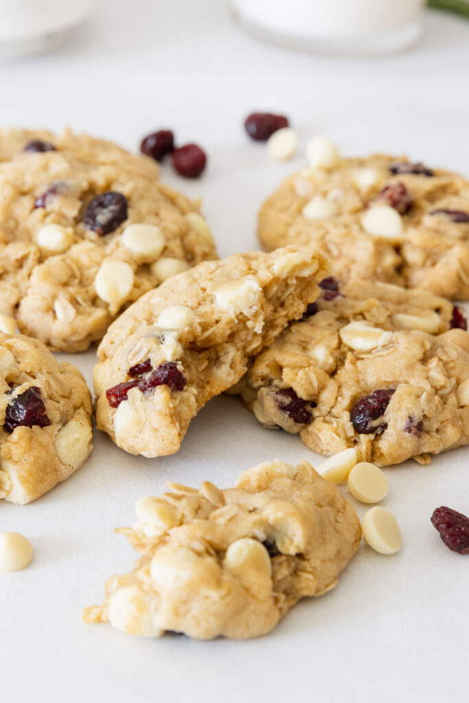 Vegan cranberry white chocolate cookie broken in two to show inside texture